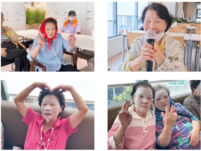 어르신들이 손하트와 브이를 하며 웃는 모습